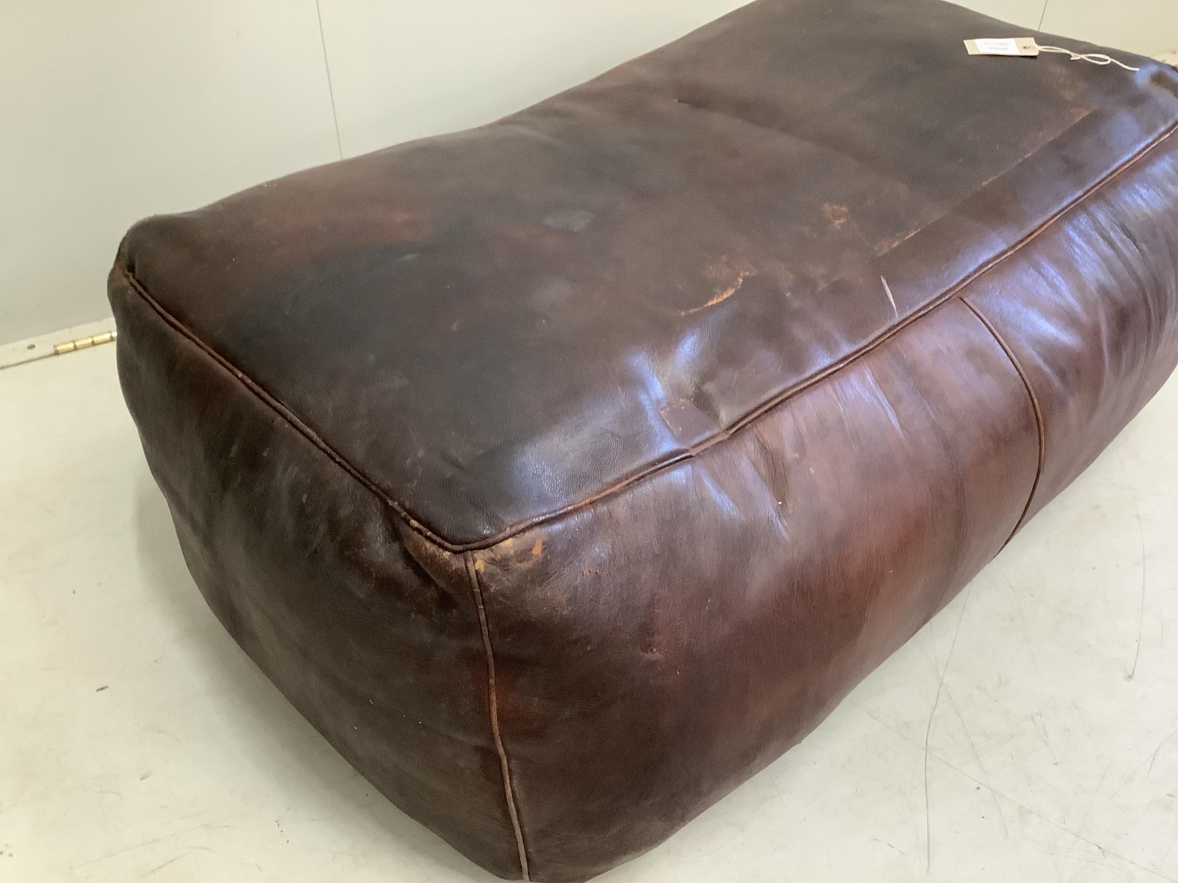 A rectangular leather ottoman, width 105cm, depth 60cm, height 35cm
